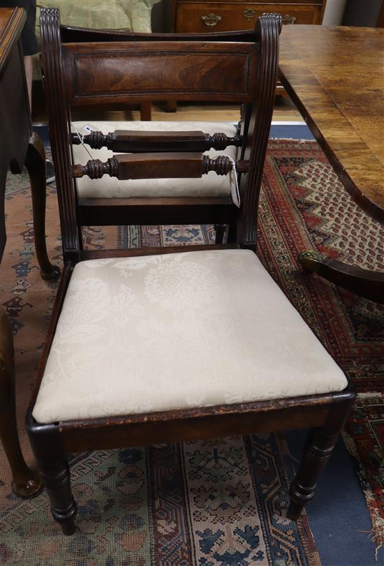 A set of three Regency mahogany dining chairs and a matching carver